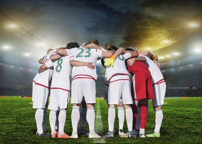 Footballers in a Huddle