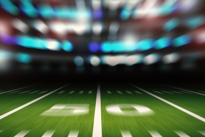 Blurred American Football 50 Yard Line in Stadium