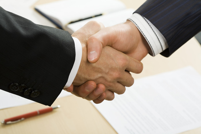 Businessmen Shaking Hands Over Deal