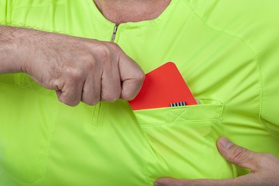 Close Up of Referee Taking Red Card from Pocket