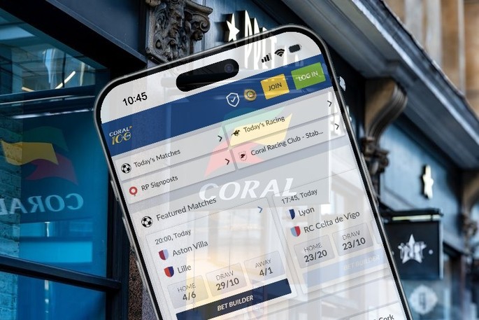 Coral Smartphone Betting Against Shop Sign