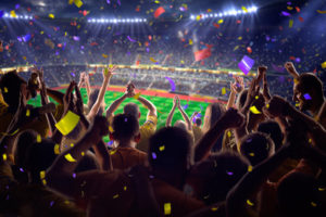 Football Fans in Stadium with Confetti