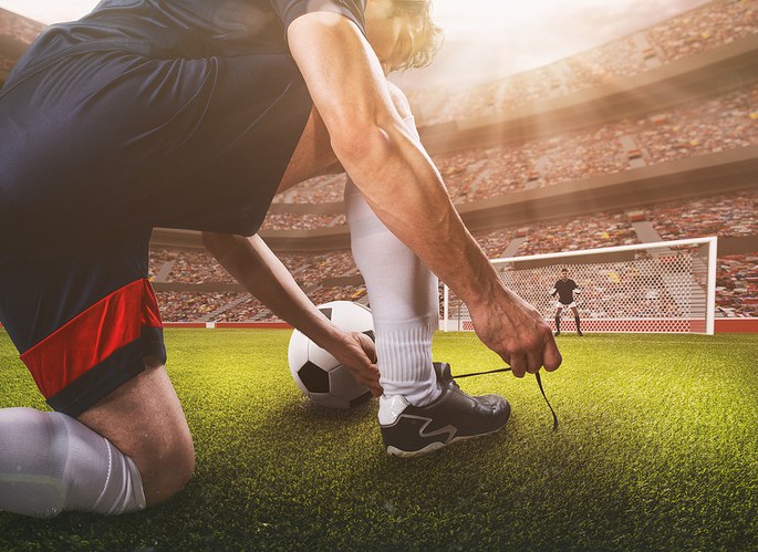 Footballer Tying Laces