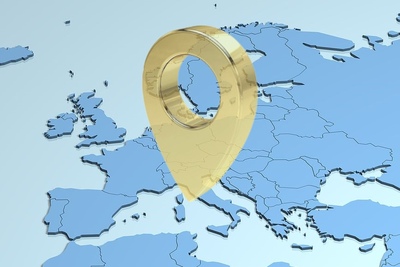 Gold Location Marker Against Europe Map in Blue