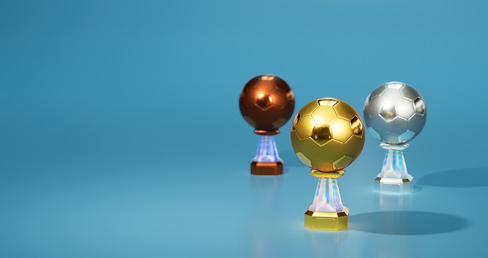 Gold, Silver, and Bronze Football Trophies