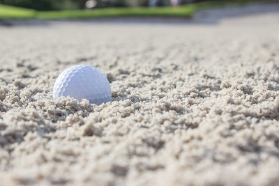 Golf Ball Sitting in Bunker