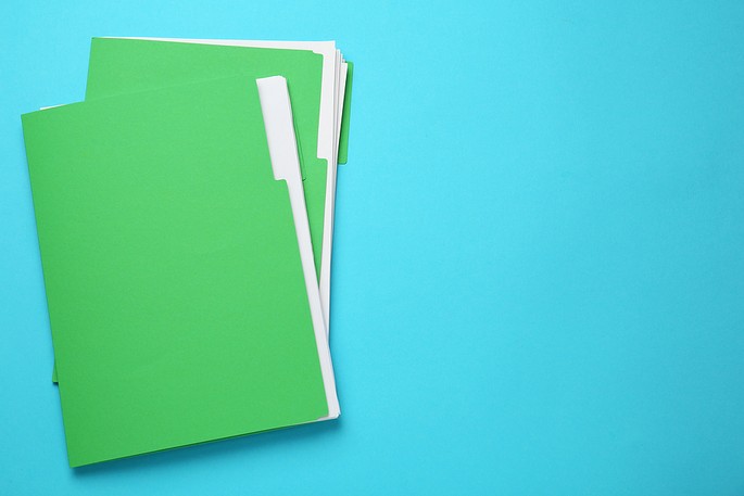Green Files on Light Blue Background