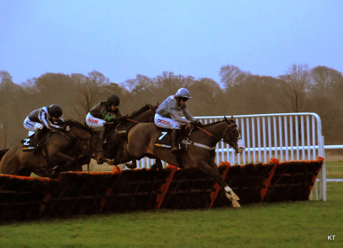 Horse Jumping Hurdle During Kempton's Christmas Hurdle