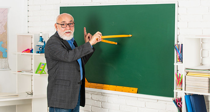 Man Teaching at Blackboard