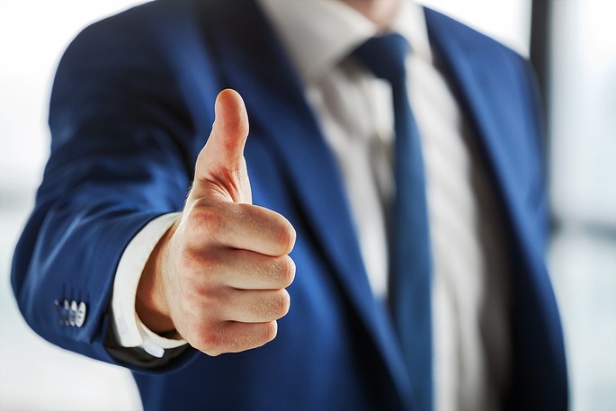 Man in Blue Suit Showing Thumb Up