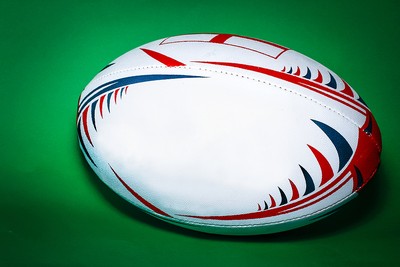 Rugby Ball Against Green Background