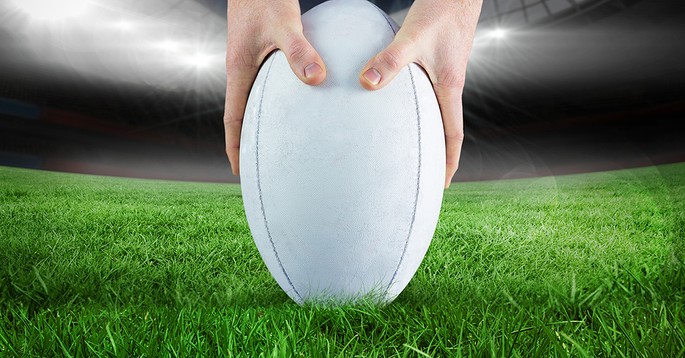 Rugby Ball Placed on Grass