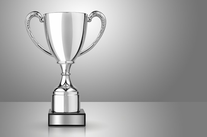 Silver Trophy Against a Grey Background