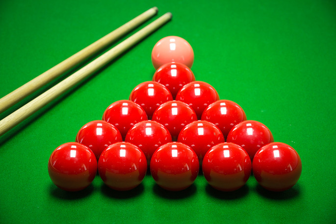 Snooker Balls and Cues on Table