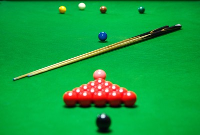 Snooker Balls Set on Table with Cues