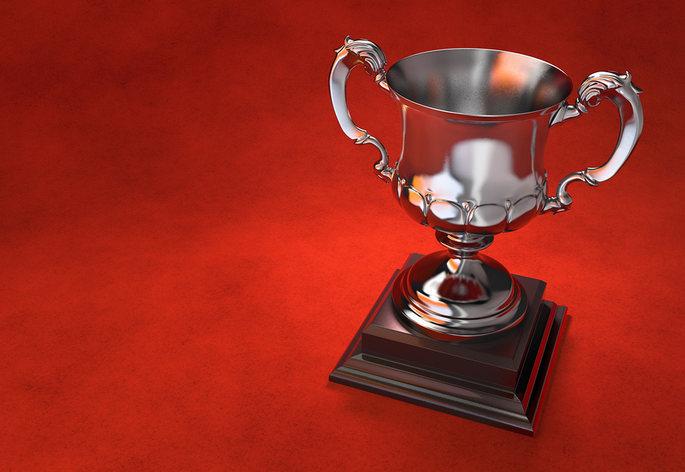 Silver Trophy on Red Background