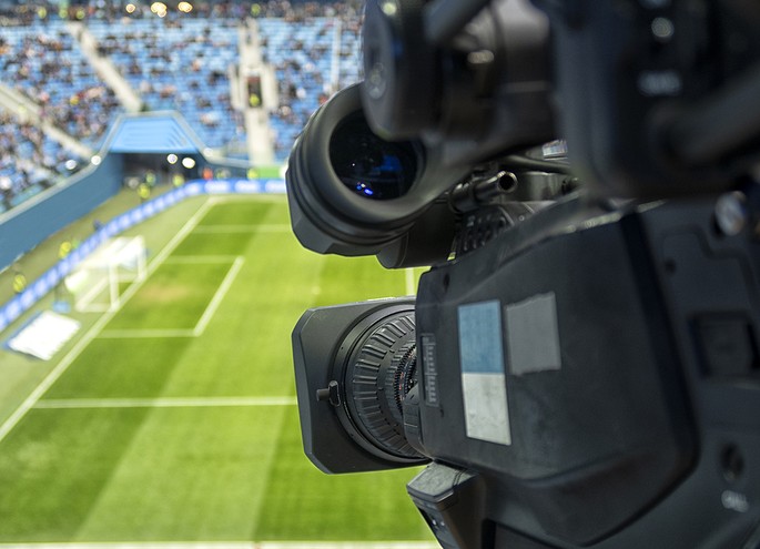 View Behind TV Camera in Football Stadium