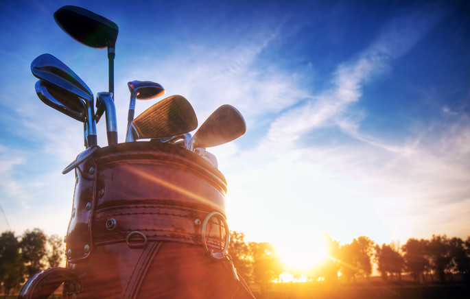 Sunrise Behind Golf Bag with Clubs