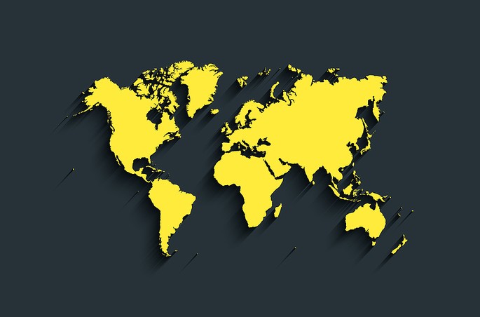 Yellow World Map Against Black Background